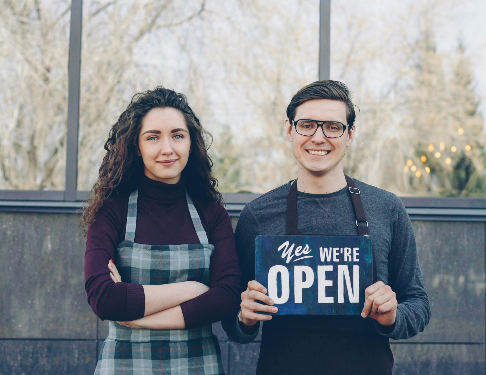 Young couple celebrating opening of their business